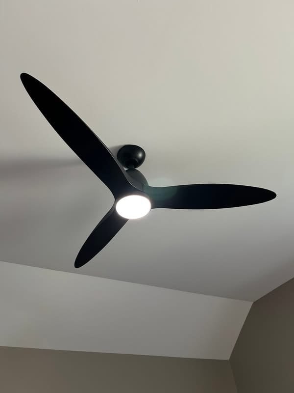 Black ceiling fan with three blades and integrated LED light mounted on a white ceiling
